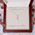 14k white gold-plated Allure necklace packaged in an elegant gift box with a card that features the Cherise Dionne logo and the phrase 'express your inner radiance'.