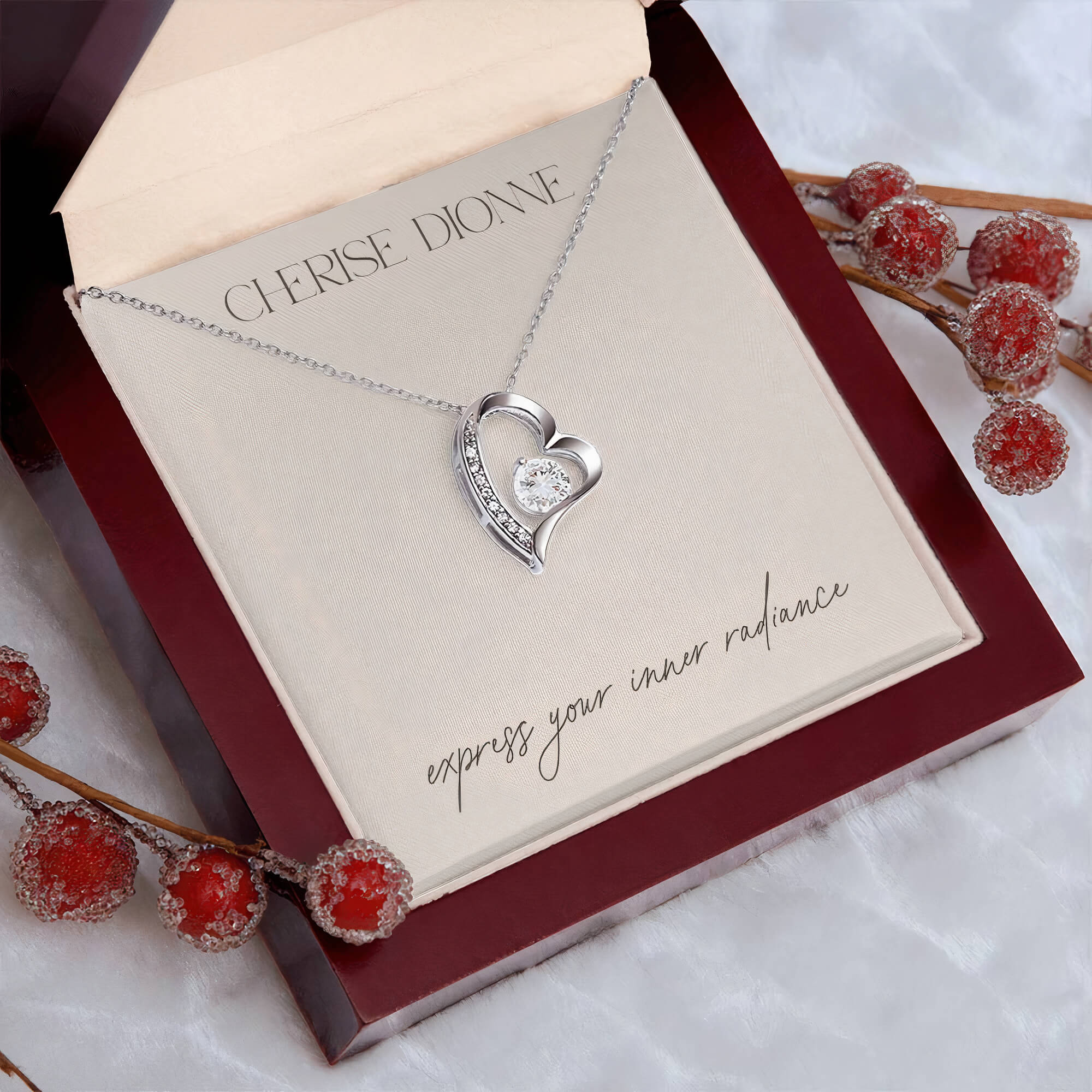 14k white gold-plated Passion necklace packaged in an elegant gift box with a card that features the Cherise Dionne logo and the phrase 'express your inner radiance'.